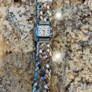 Fossil braided multi-color leather strap and stainless steel watch.